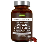 A brown amber bottle of Igennus Healthcare Nutrition Vegan Omega-3 & Astaxanthin softgels with a silver cap, shown on a white background with two red softgels in front.
