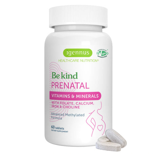 A white bottle of Igennus Be Kind Prenatal vitamins and minerals with three light gray tablets in front, on a solid white background.