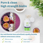 Pure & clean high strength biotin supplement with a bowl of fruit and a plant on a white background