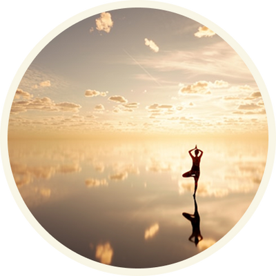 A circular art print or poster featuring a silhouette of a person in a yoga pose standing on reflective water at sunset, with clouds and golden light reflected in the water.